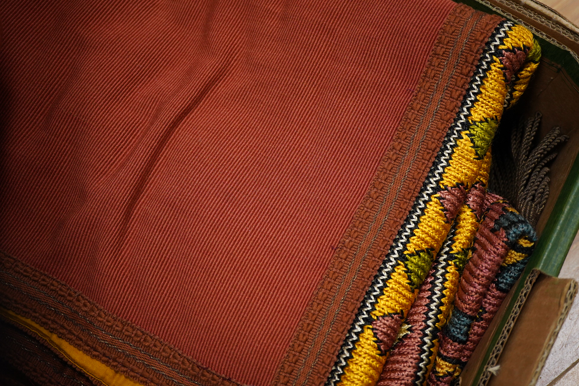 A unusual matching group of 20th century French Ecclesiastical knitted textiles, with Caucasian design elements. Hand embroidered with coloured silks in a bold geometric design, bordered with gold braiding and tasselling